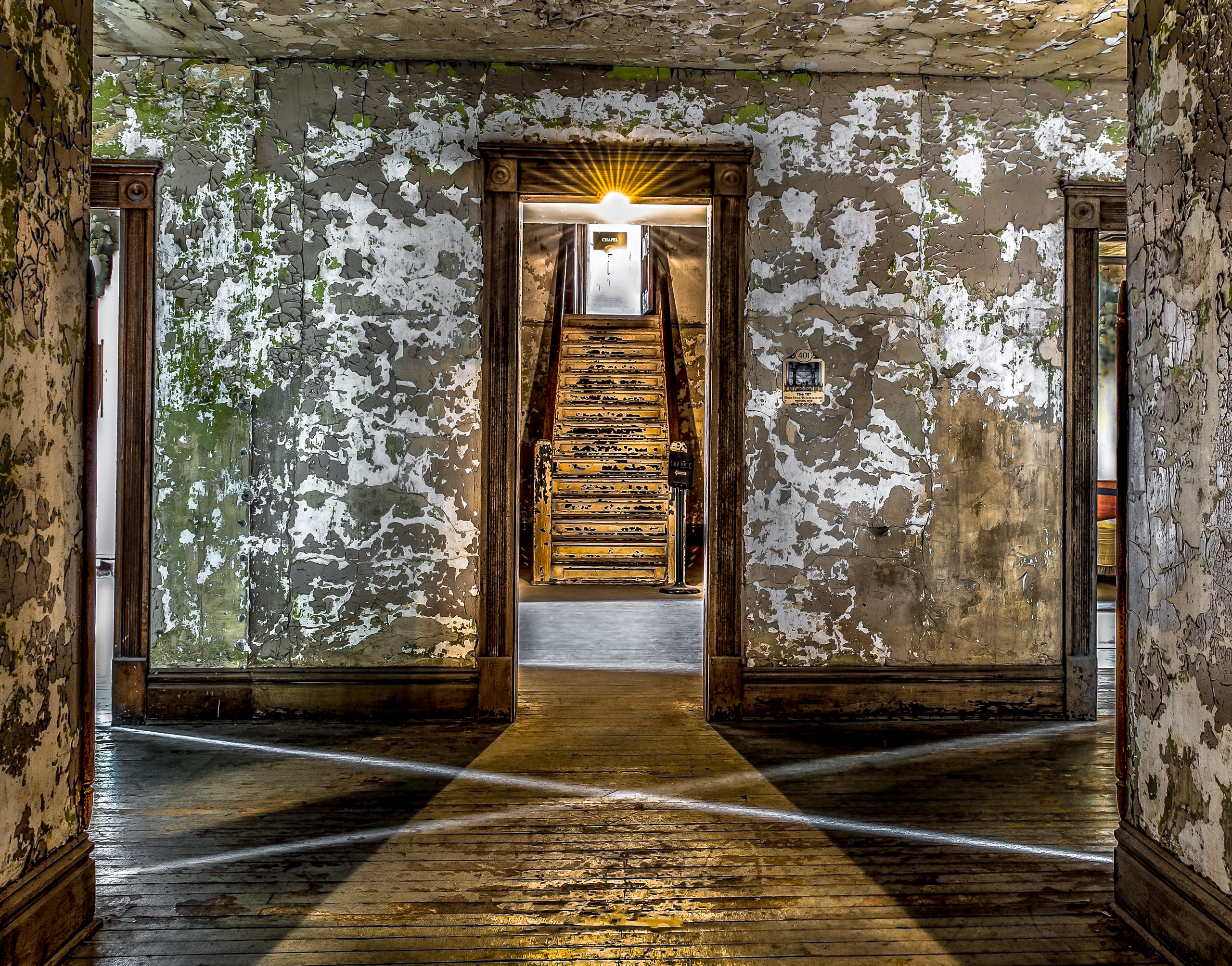 Abandoned Ohio State Reformatory Chapel Staircase with staircase, peeling paint and light manipulations.