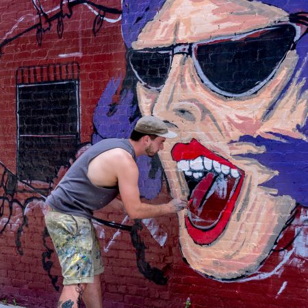 Mural painted by graffiti artist on street wall Baltimore, Maryland.