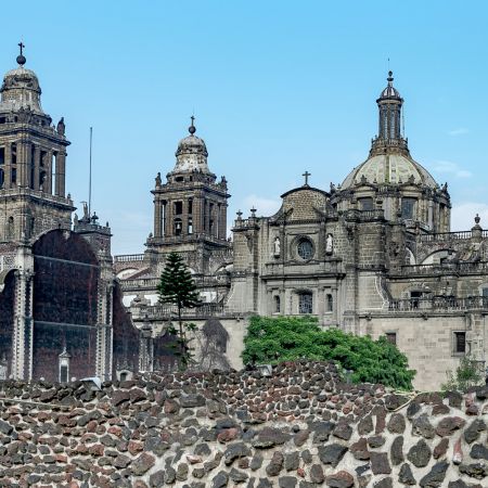 Metropolitan Cathedral in Mexico City with ancient ruins in foreground.