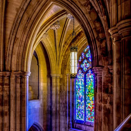 Balcony level and stained glass window of the Washington National Cathedral.