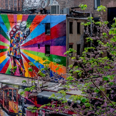 New York multi-colored mural adaptation of Alfred Eisenstaedt’s iconic photo - V-J Day in Times Square, New York, August 14, 1945 - featured along High Line.