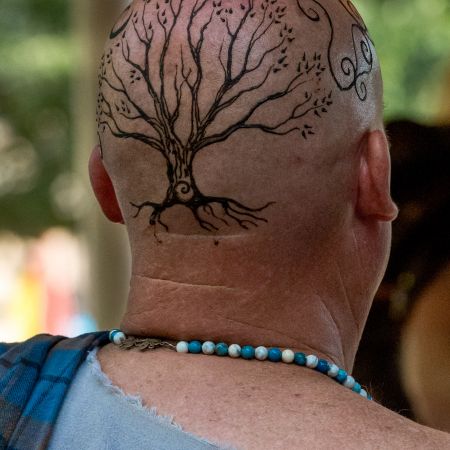 Man with tattoo on head for Maryland Renaissance Festival in Brownsville, Maryland.