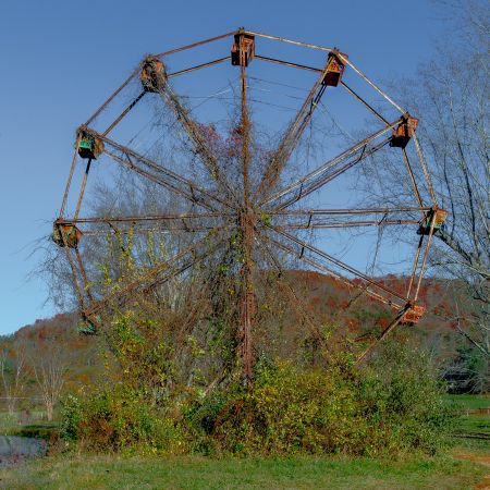 Abandoned West Virginia Ferris Wheel covered in vines.