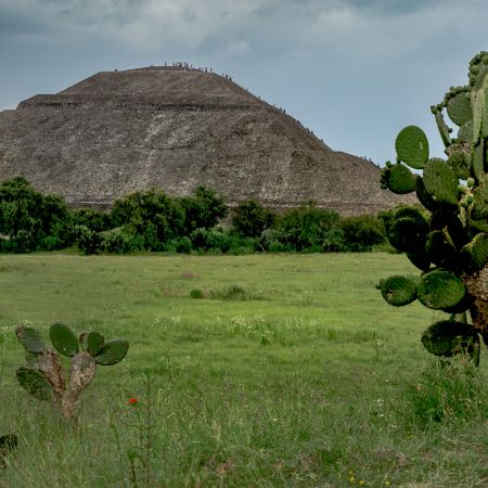 People climbing steps of Mexico's Teotihuacan Pyramid.