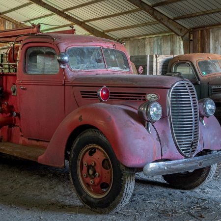 1930s red fire truck with ladder.