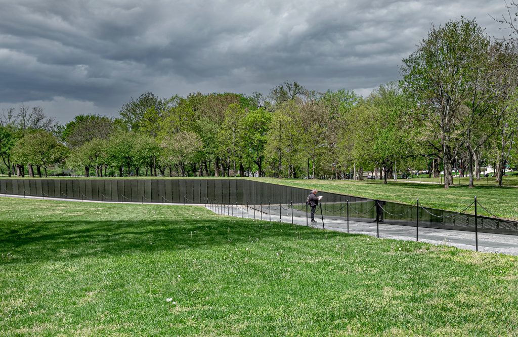 Sole man at D.C.'s Vietnam Memorial during COVID.