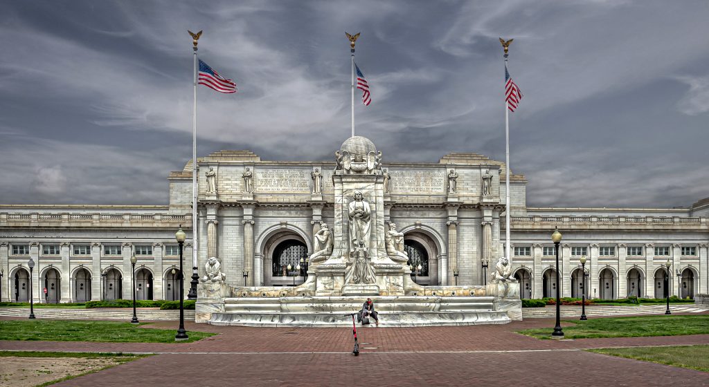 Union Station with homeless man and scooter during COVID.