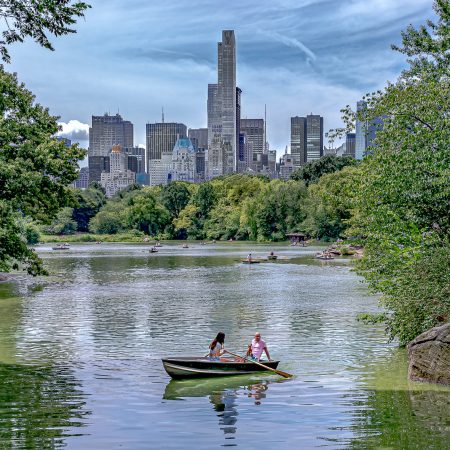 Skyline and lake landscape in Central Park, New York.