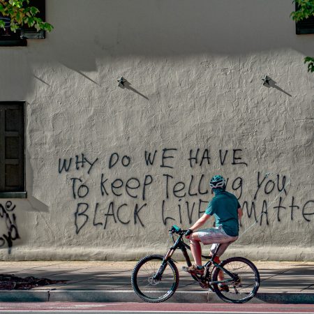 Aftermath of George Floyd riots in Washington DC with Black Lives Matter Graffiti on public building.