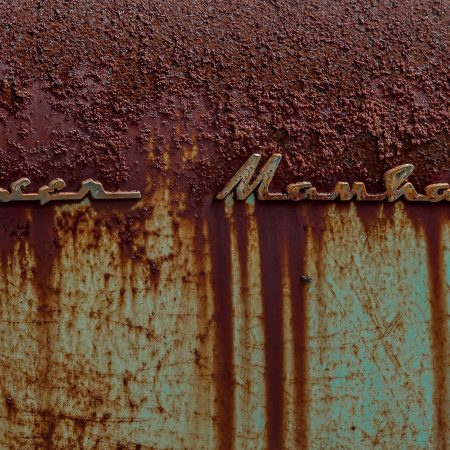 Kaiser Manhattan nameplate and dripping advanced rust on turquoise body.