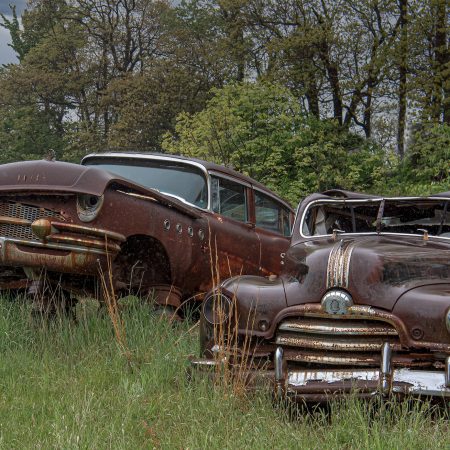 1955 Buick Super Car with portholes and 1942 Pontiac Torpedo with hood ornament.