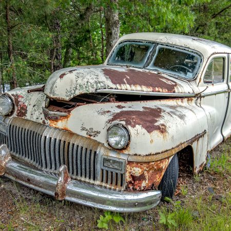 Classic 1940 Chrysler Division DeSoto with ivory finish and rust.