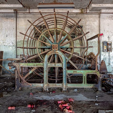 Giant wooden loom at abandoned textile factory.