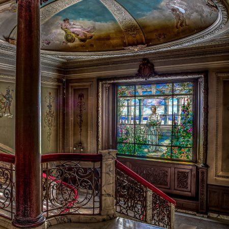 Swannanoa Palace mansion in Alton, Virginia featuring Tiffany window of image of original owner's wife, and painted and plastered ceiling dome, wrought iron railing with marble posts and floor, marquetry detailed wood floor and doric columns