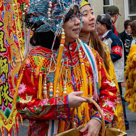 Chinese New Year Parade with women in traditional costume.