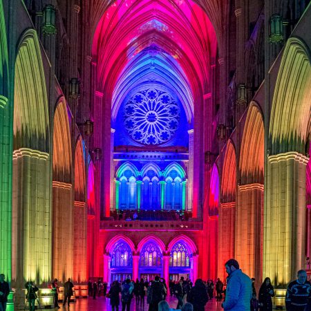 Seeing Deeper Event in Nave of National Cathedral with rosette, vaulted ceilings and arches.