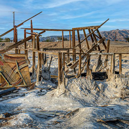 The detritus of man on Bombay Beach in Salton Sea California including the remains of a piano.