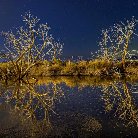 Light painted reflections with some illumination help from the nearby geothermal plant at blue hour in Salton Sea.